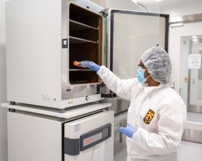 A researcher in the Marcus Center of Excellence for Cell Biomanufacturing removes cultured cells from an incubator for further characterization and testing.